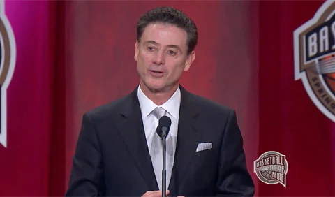 Photo shows Rick Pitino speaking at Naismith Memorial Basketball Hall of Fame induction ceremony September 9, 2013.