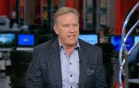 Photo shows John Elway speaking in an interview in early 2013 on the Morning Joe Show on MSNBC.