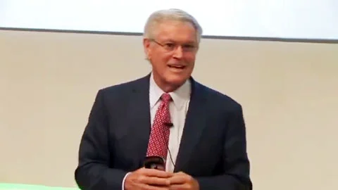 Photo shows retired NFL coach, Dick Vermeil, speaking to a group of SAP employees about his seven common sense leadership principles.